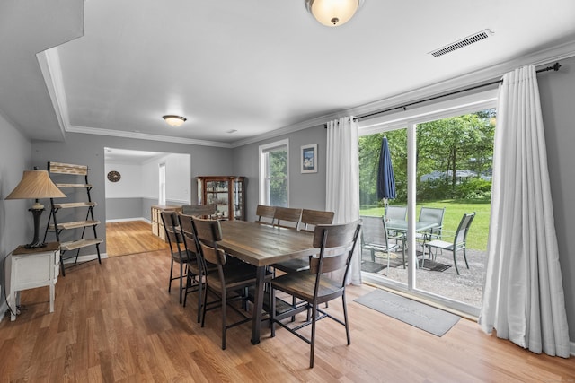 15 Ridgewood Dr, Monroe, CT 06468 - dining room featuring plenty of natural light, light wood finished floors, crown molding, and baseboards