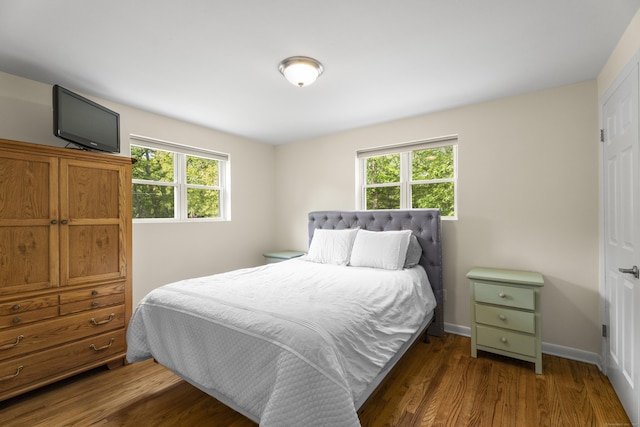 15 Ridgewood Dr, Monroe, CT 06468 - bedroom with multiple windows, wood finished floors, and baseboards