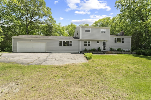 15 Ridgewood Dr, Monroe, CT 06468 - back of house with a garage, a lawn, asphalt driveway, and a chimney