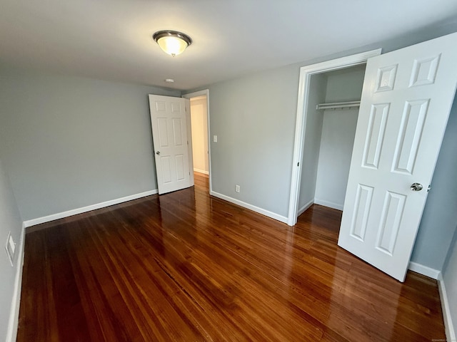 16-1/2 W Main St, Norwalk, CT 06851 - unfurnished bedroom with a closet, wood finished floors, and baseboards