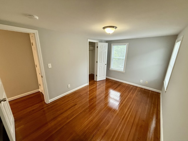 16-1/2 W Main St, Norwalk, CT 06851 - unfurnished bedroom featuring wood finished floors, baseboards, and a closet