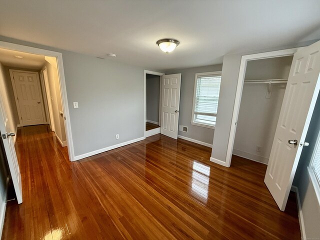 16-1/2 W Main St, Norwalk, CT 06851 - unfurnished bedroom featuring wood finished floors, baseboards, and a closet