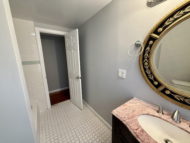 16-1/2 W Main St, Norwalk, CT 06851 - bathroom with vanity, a bathtub, and baseboards