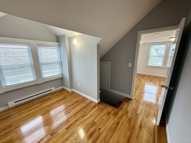 16-1/2 W Main St, Norwalk, CT 06851 - additional living space with baseboard heating, lofted ceiling, light wood-style floors, and baseboards