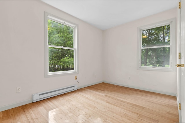 2 Lakeview Cir E, Lyme, CT 06357 - unfurnished room featuring a baseboard radiator, plenty of natural light, hardwood / wood-style floors, and baseboards