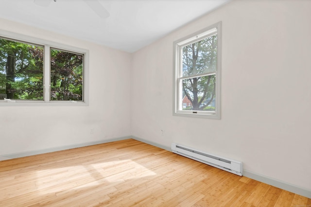 2 Lakeview Cir E, Lyme, CT 06357 - unfurnished room featuring baseboard heating, healthy amount of natural light, wood finished floors, and baseboards