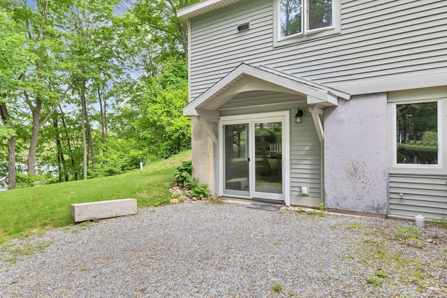 2 Lakeview Cir E, Lyme, CT 06357 - property entrance featuring a lawn and a patio area