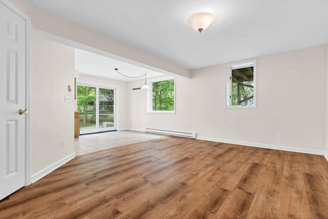 2 Lakeview Cir E, Lyme, CT 06357 - empty room featuring a baseboard heating unit, wood finished floors, and baseboards