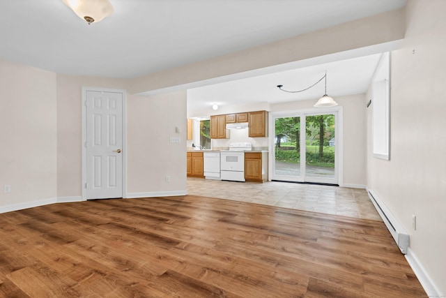 2 Lakeview Cir E, Lyme, CT 06357 - unfurnished living room featuring a baseboard heating unit, light wood-style flooring, baseboards, and a sink