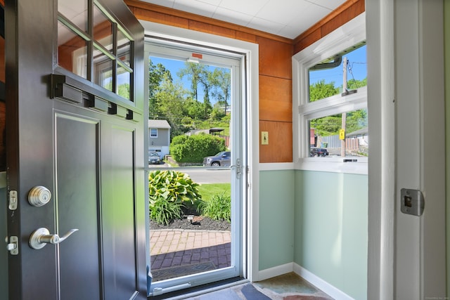 101 Rosengarten Dr, Waterbury, CT 06704 - doorway featuring plenty of natural light, baseboards, and wood walls