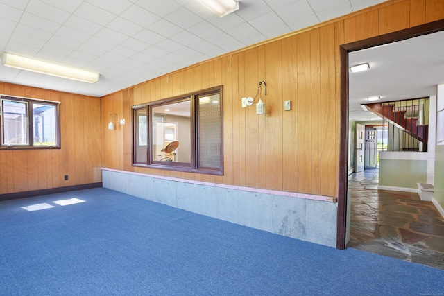 101 Rosengarten Dr, Waterbury, CT 06704 - carpeted spare room with wooden walls