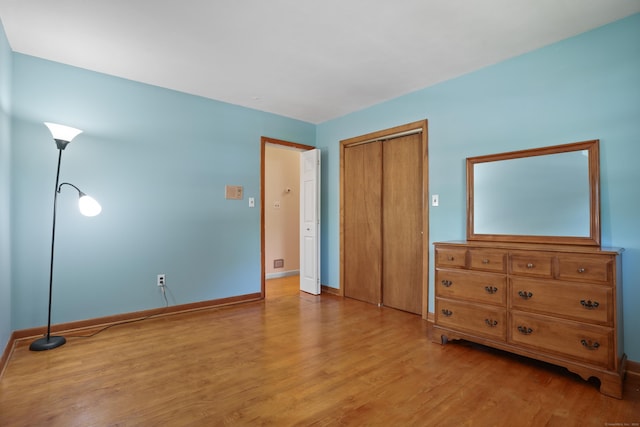 101 Rosengarten Dr, Waterbury, CT 06704 - bedroom featuring wood finished floors, a closet, and baseboards