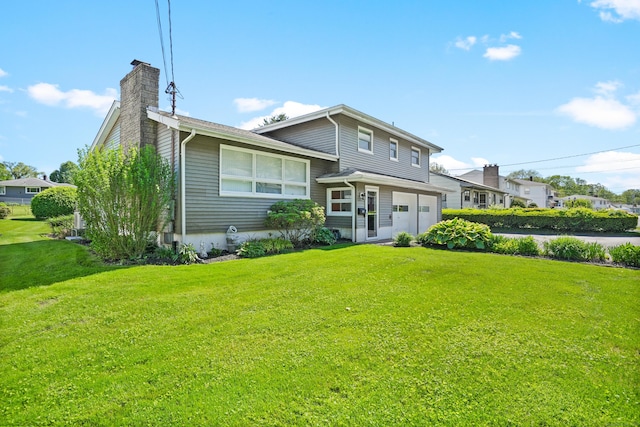 101 Rosengarten Dr, Waterbury, CT 06704 - rear view of house featuring a chimney, a garage, and a lawn
