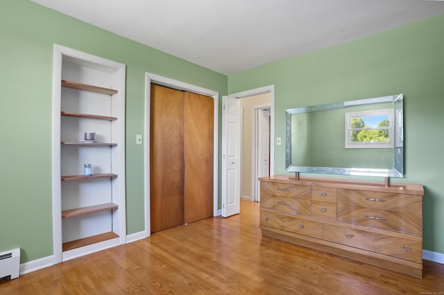 101 Rosengarten Dr, Waterbury, CT 06704 - bedroom featuring light wood finished floors, baseboards, and a baseboard radiator