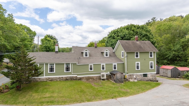 538 Scotland Rd, Norwich, CT 06360 - back of property featuring a chimney, a shingled roof, and a lawn