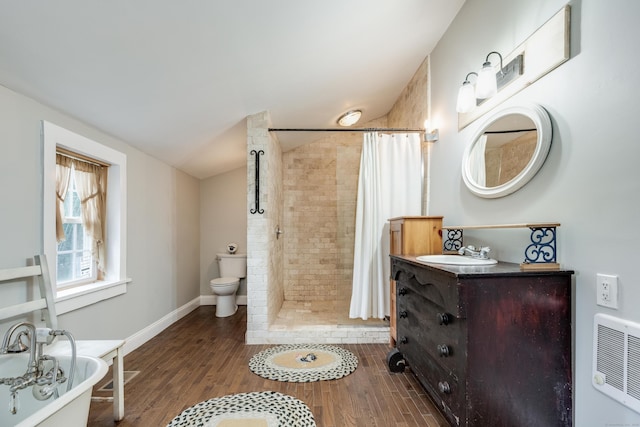 538 Scotland Rd, Norwich, CT 06360 - full bath featuring wood finished floors, a tile shower, a soaking tub, toilet, and vanity