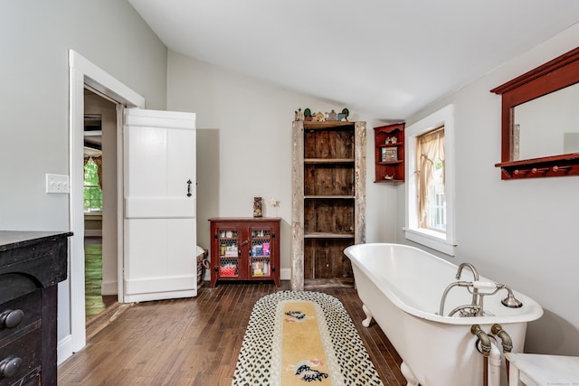 538 Scotland Rd, Norwich, CT 06360 - full bath featuring wood finished floors, vaulted ceiling, and a soaking tub