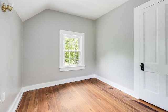 538 Scotland Rd, Norwich, CT 06360 - empty room featuring wood-type flooring, lofted ceiling, and baseboards
