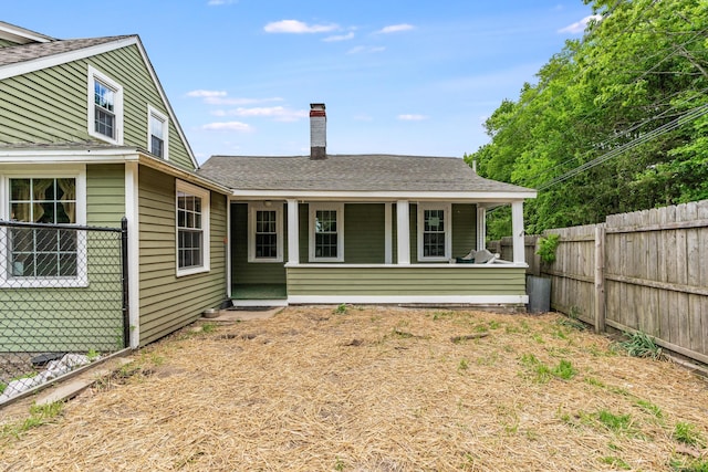 538 Scotland Rd, Norwich, CT 06360 - back of house featuring a porch, a chimney, and roof with shingles
