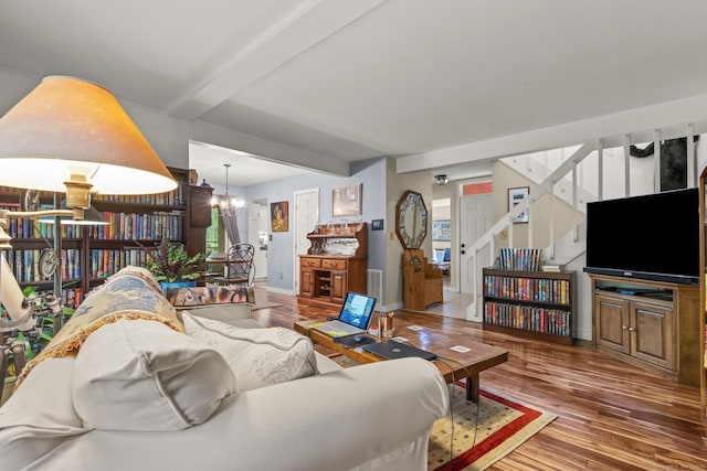 9 Lower Commons Unit 9, Woodbury, CT 06798 - living room with wood finished floors, beamed ceiling, stairway, baseboards, and plenty of natural light