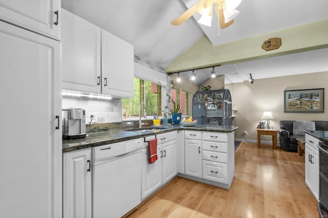 9 Lower Commons Unit 9, Woodbury, CT 06798 - kitchen featuring dishwasher, a sink, vaulted ceiling, a peninsula, and open floor plan
