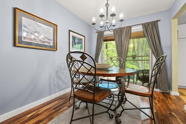 9 Lower Commons Unit 9, Woodbury, CT 06798 - dining area with baseboards, a chandelier, and wood finished floors