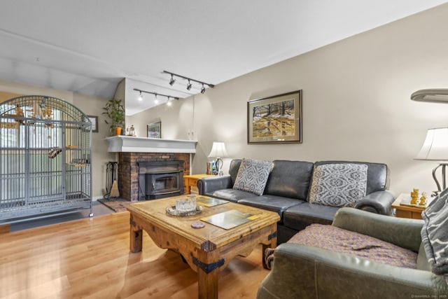 9 Lower Commons Unit 9, Woodbury, CT 06798 - living area with wood finished floors, track lighting, and a fireplace