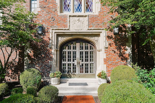 182 Fern St Apt 4, West Hartford, CT 06119 - view of exterior entry featuring french doors and brick siding