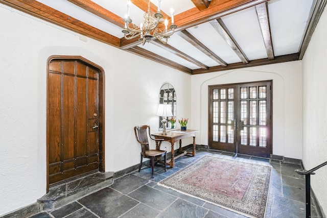 182 Fern St Apt 4, West Hartford, CT 06119 - entrance foyer with stone tile flooring, a chandelier, a textured wall, beam ceiling, and french doors