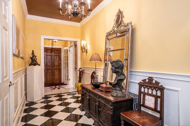 182 Fern St Apt 4, West Hartford, CT 06119 - hall with a chandelier, a wainscoted wall, crown molding, and a decorative wall