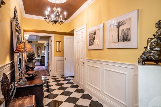 182 Fern St Apt 4, West Hartford, CT 06119 - hallway with a decorative wall, ornamental molding, a wainscoted wall, and a chandelier