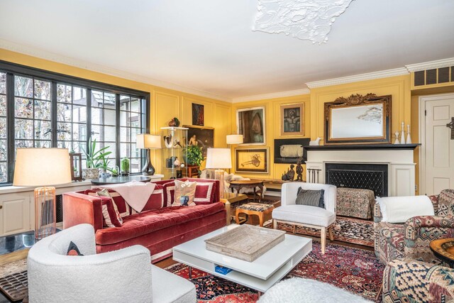 182 Fern St Apt 4, West Hartford, CT 06119 - living area with crown molding, a decorative wall, and a fireplace