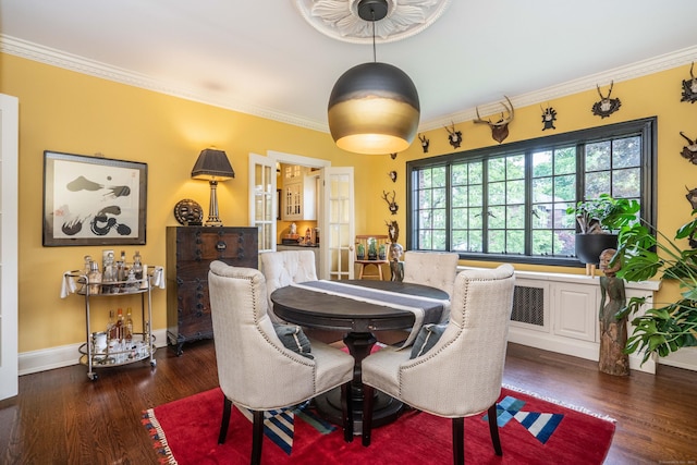 182 Fern St Apt 4, West Hartford, CT 06119 - dining area with ornamental molding, wood finished floors, and baseboards