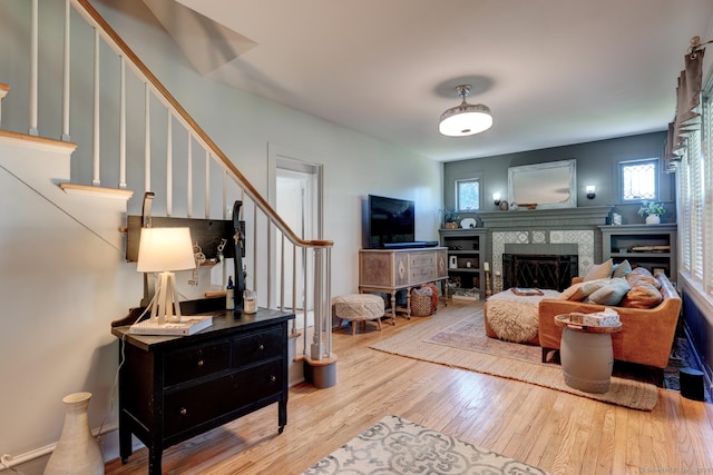 21 Elm St, Southington, CT 06479 - living area with wood finished floors, stairs, and a fireplace