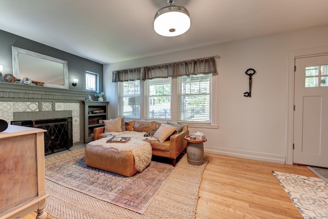 21 Elm St, Southington, CT 06479 - living room featuring wood finished floors, a fireplace, and baseboards