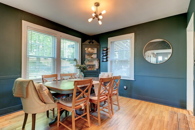 21 Elm St, Southington, CT 06479 - dining space featuring a chandelier, light wood finished floors, and baseboards