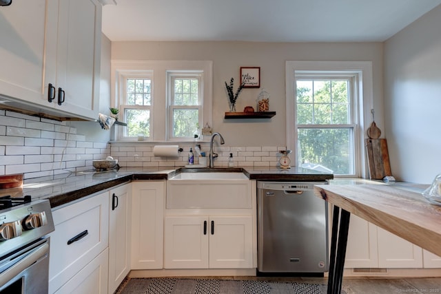 21 Elm St, Southington, CT 06479 - kitchen featuring appliances with stainless steel finishes, healthy amount of natural light, wood counters, and white cabinets