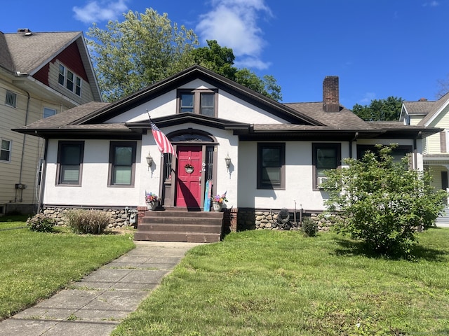 66 Seymour Ave, Derby, CT 06418 - bungalow-style house featuring a chimney, a front yard, stucco siding, and roof with shingles