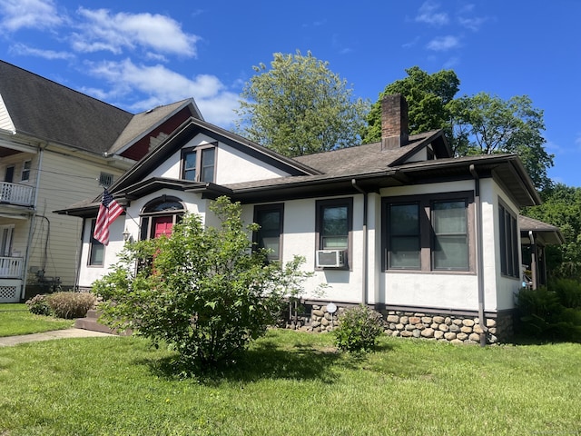 66 Seymour Ave, Derby, CT 06418 - view of side of home featuring a chimney, stucco siding, a yard, and cooling unit
