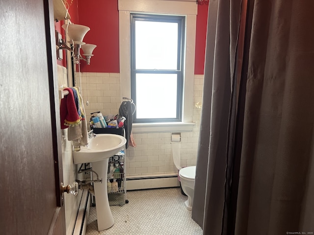 66 Seymour Ave, Derby, CT 06418 - bathroom with baseboard heating, tile walls, healthy amount of natural light, a wainscoted wall, and toilet