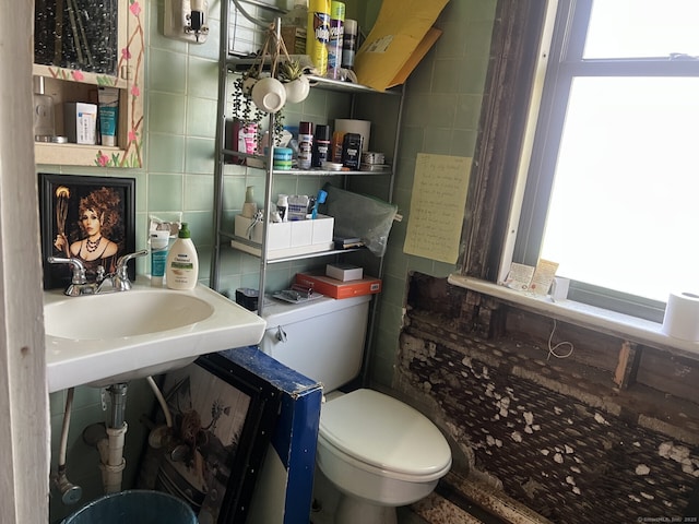 66 Seymour Ave, Derby, CT 06418 - half bath with plenty of natural light, tile walls, toilet, and backsplash