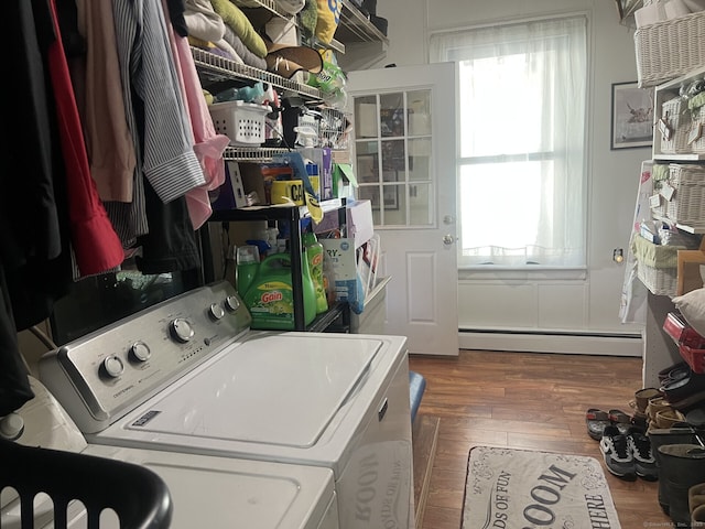 66 Seymour Ave, Derby, CT 06418 - laundry area with baseboard heating, washer and clothes dryer, plenty of natural light, and wood finished floors