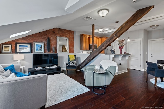 461 Bank St Unit 410, New London, CT 06320 - living area featuring lofted ceiling, dark wood-type flooring, brick wall, and baseboards
