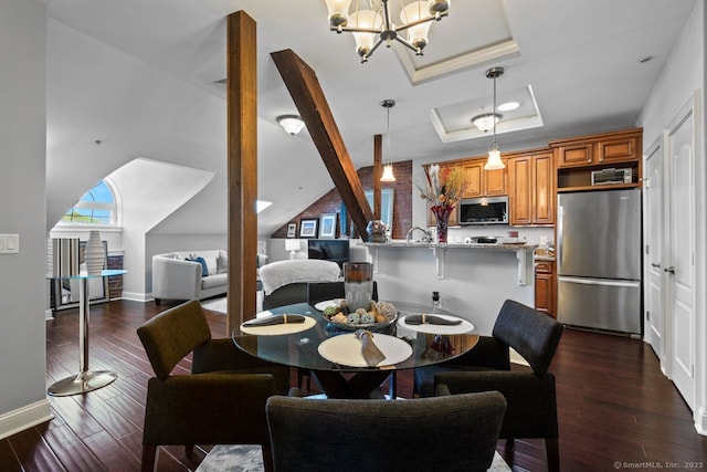 461 Bank St Unit 410, New London, CT 06320 - dining room featuring a raised ceiling, dark wood-style flooring, baseboards, and a chandelier