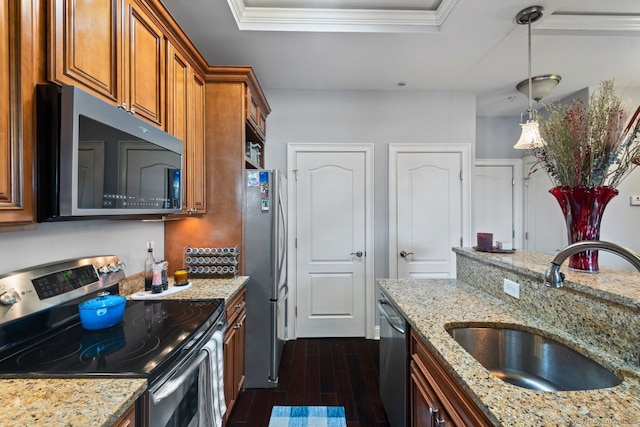 461 Bank St Unit 410, New London, CT 06320 - kitchen with appliances with stainless steel finishes, a sink, brown cabinetry, dark wood-type flooring, and a raised ceiling