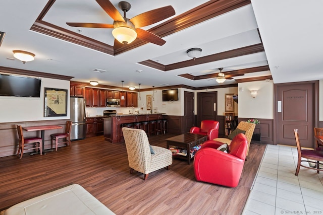 461 Bank St Unit 410, New London, CT 06320 - living area with a ceiling fan, ornamental molding, a raised ceiling, light wood-type flooring, and a wainscoted wall