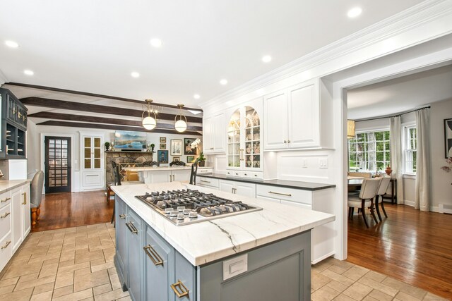 19 Pheasant Ridge Rd, Redding, CT 06896 - kitchen with white cabinets, stainless steel gas cooktop, open floor plan, a center island, and recessed lighting
