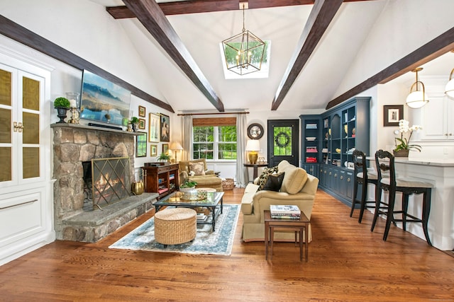 19 Pheasant Ridge Rd, Redding, CT 06896 - living room featuring wood finished floors, a chandelier, and a stone fireplace