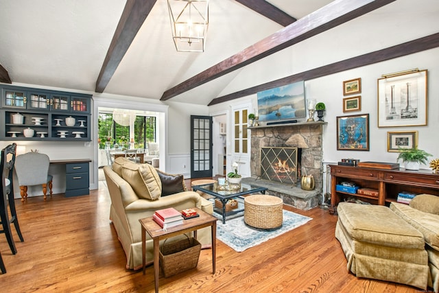 19 Pheasant Ridge Rd, Redding, CT 06896 - living room with wood finished floors, a fireplace, an office area, and a wainscoted wall