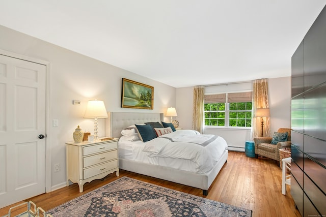 19 Pheasant Ridge Rd, Redding, CT 06896 - bedroom featuring light wood-type flooring and a baseboard heating unit